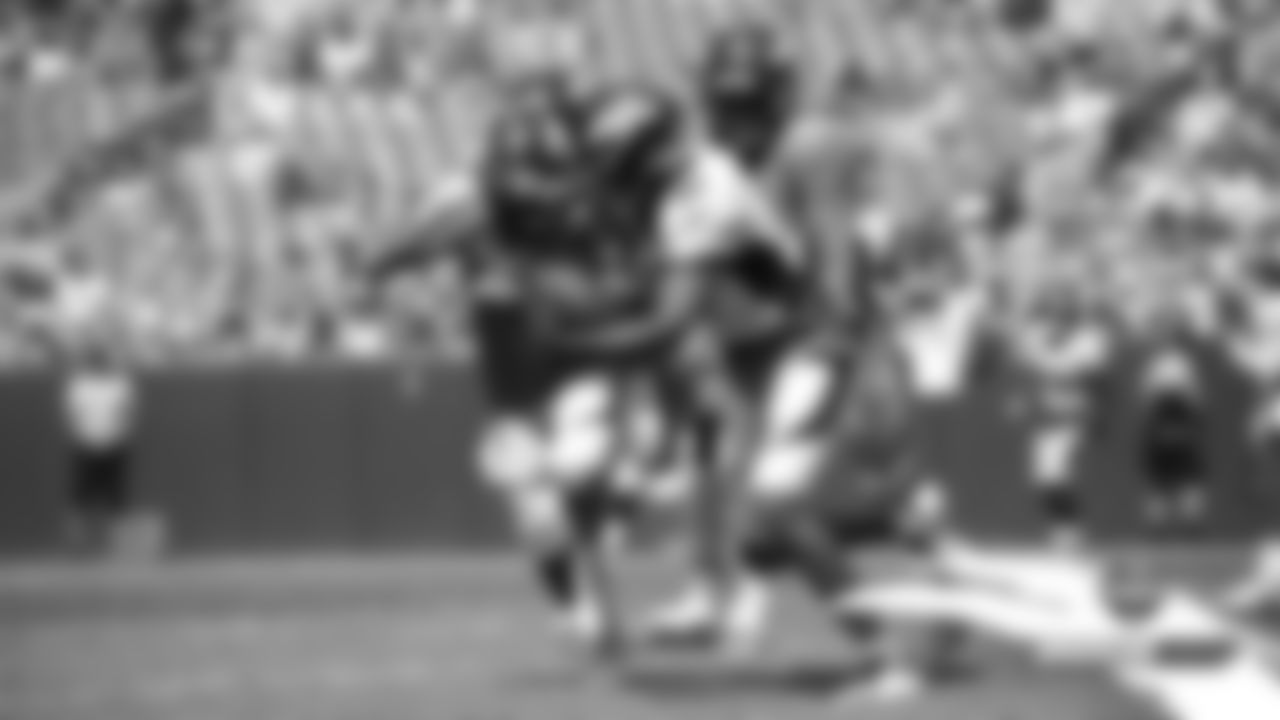 Tim Patrick tries to stiff-arm a defender during practice on Day 9 of training camp at Broncos Stadium at Mile High on July 27, 2019.