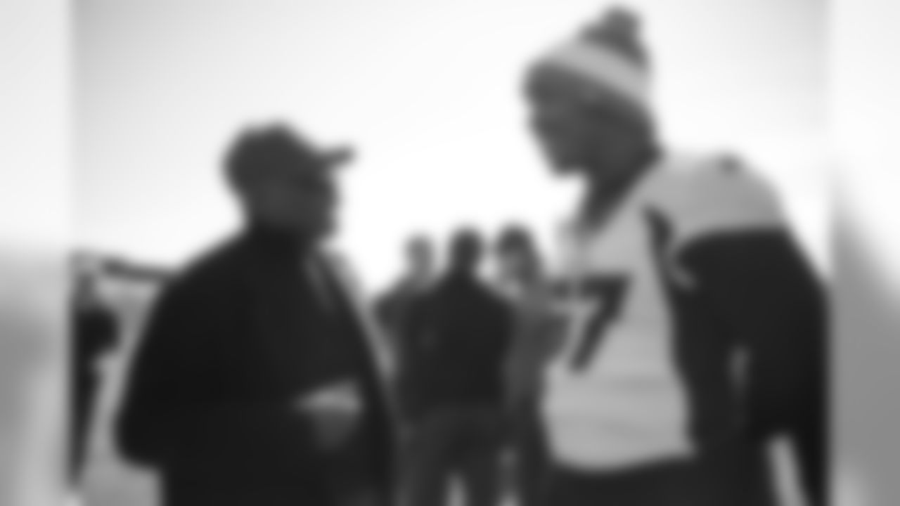 Floyd Little talks with DeMarcus Walker as Broncos alumni watch the team's walkthrough and meet with current players and coaches afterward on October 12, 2019. (Photo by Ben Swanson)