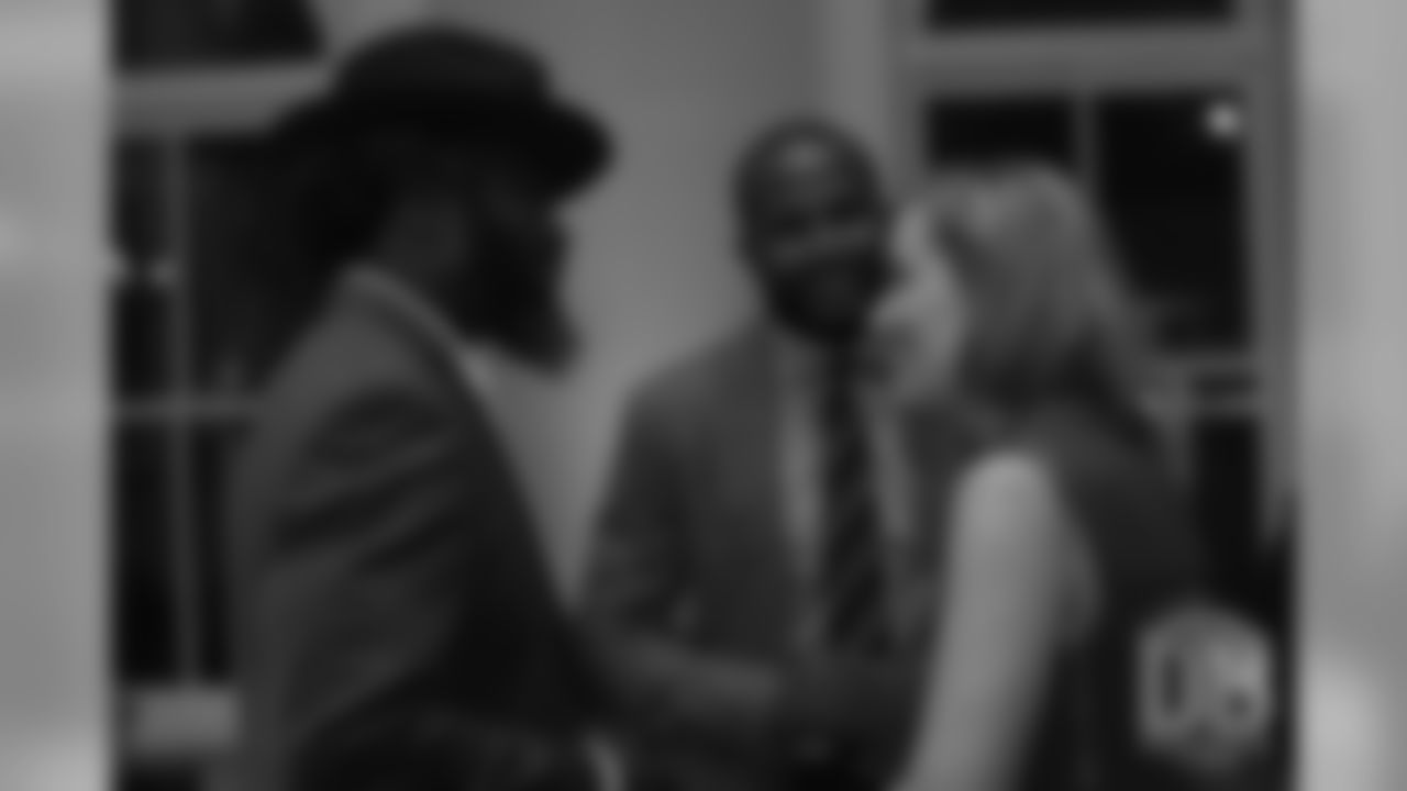 Brittany Bowlen greets Ed Reed at the Pro Football Hall of Fame's Celebration of Excellence Reception in Atlanta on January 31, 2019.