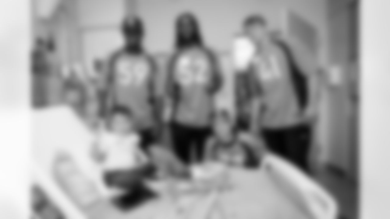 Thomas Incoom, Marcus Haynes, Riley Moss and Drew Sanders during a visit to Children's Hospital Colorado on June 20, 2023 in Aurora, Colorado. Photo by Ben Swanson / Denver Broncos