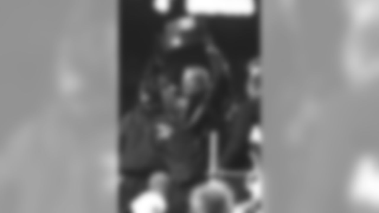 Pat Bowlen hoists another AFC Championship trophy up for the fans at Mile High to see after beating the New York Jets at Mile High Stadium in Denver, CO on January 17, 1999.