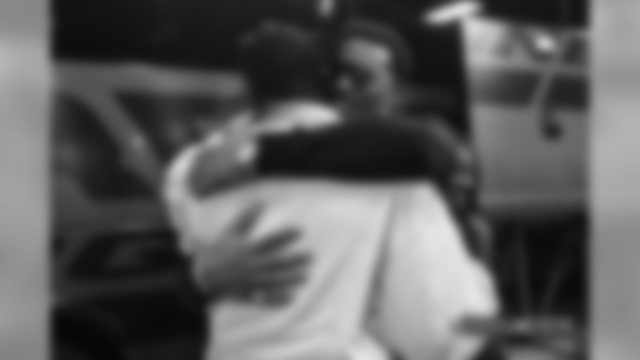 Demaryius Thomas hugs Von Miller during pregame warmups before the Broncos' Week 9 game against the Houston Texans at Broncos Stadium at Mile High on November 4, 2018.
