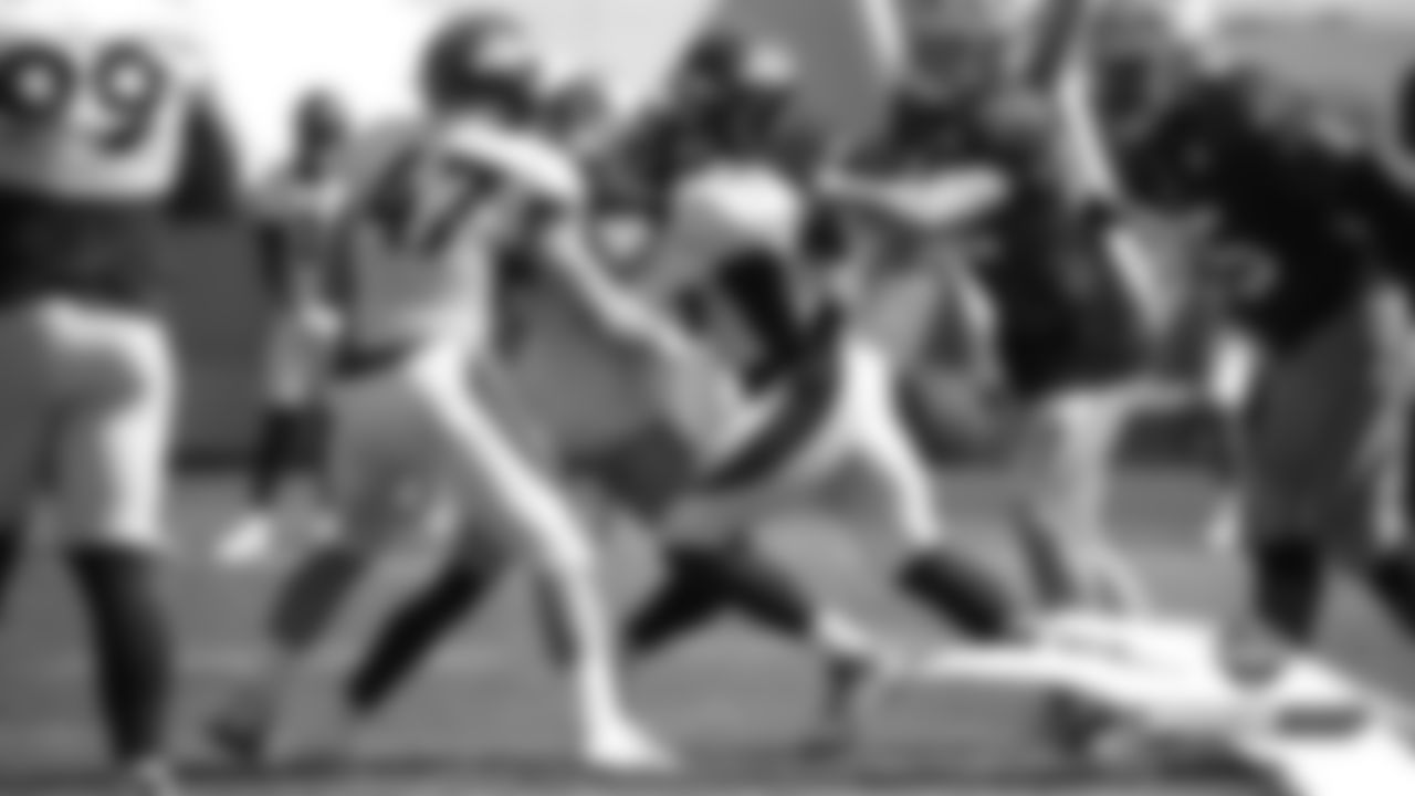 Josey Jewell and Alexander Johnson combine to stop a 49ers running back at a joint practice with the San Francisco 49ers on the 20th day of training camp on August 17, 2019.