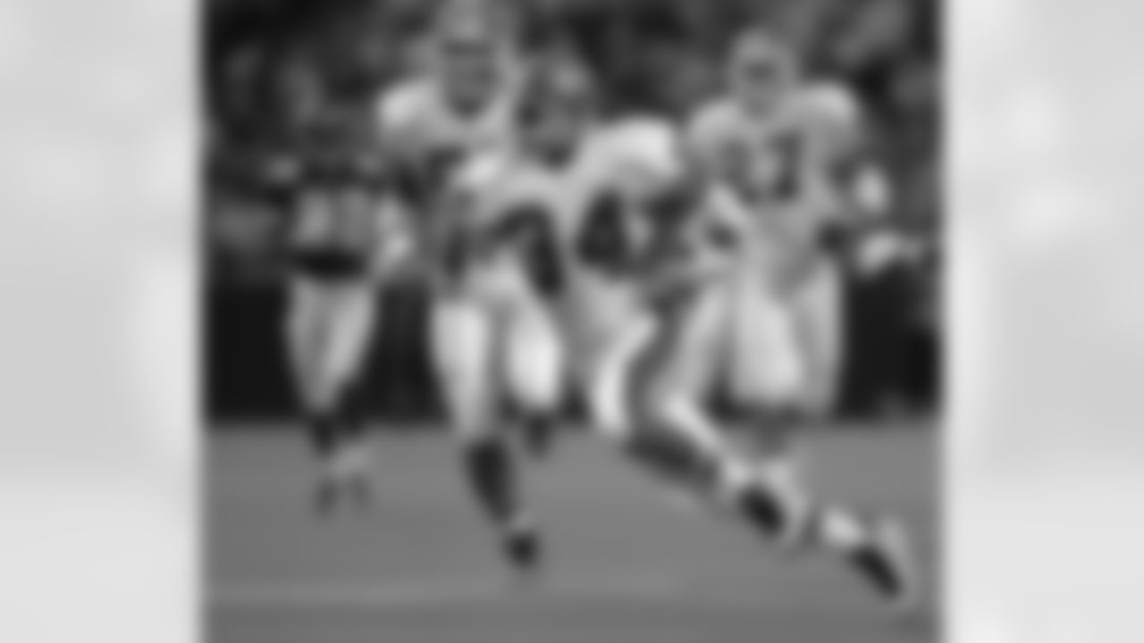 Here, Tyrone Braxton helps set up the Broncos' first score in a thrilling game against the Vikings in 1996. But the play of the game would come with less than half a minute remaining and the Broncos at the Vikings' 5-yard line. John Elway threw into traffic in the middle of the field, and multiple Vikings defenders got their hands on the ball with a chance at ending the comeback â€" but ultimately Ed McCaffrey plucked the ball out of the air at the 1-yard line and fought through a tackle to score the game-winning touchdown. (AP Photo/Jim Mone)