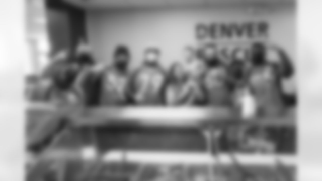 Jonas Griffith, Quinn Meinerz, Netane Muti, Justin Simmons, Lloyd Cushenberry III, Dalton Risner and McTelvin Agim help prepare and serve meals at Denver Rescue Mission in Denver, Colorado on October 5, 2021. (Photo by Sam Weaver)
