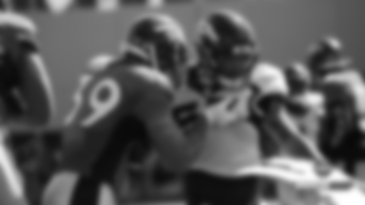 George Aston blocks Joe Dineen during practice on Day 16 of training camp on August 12, 2019.