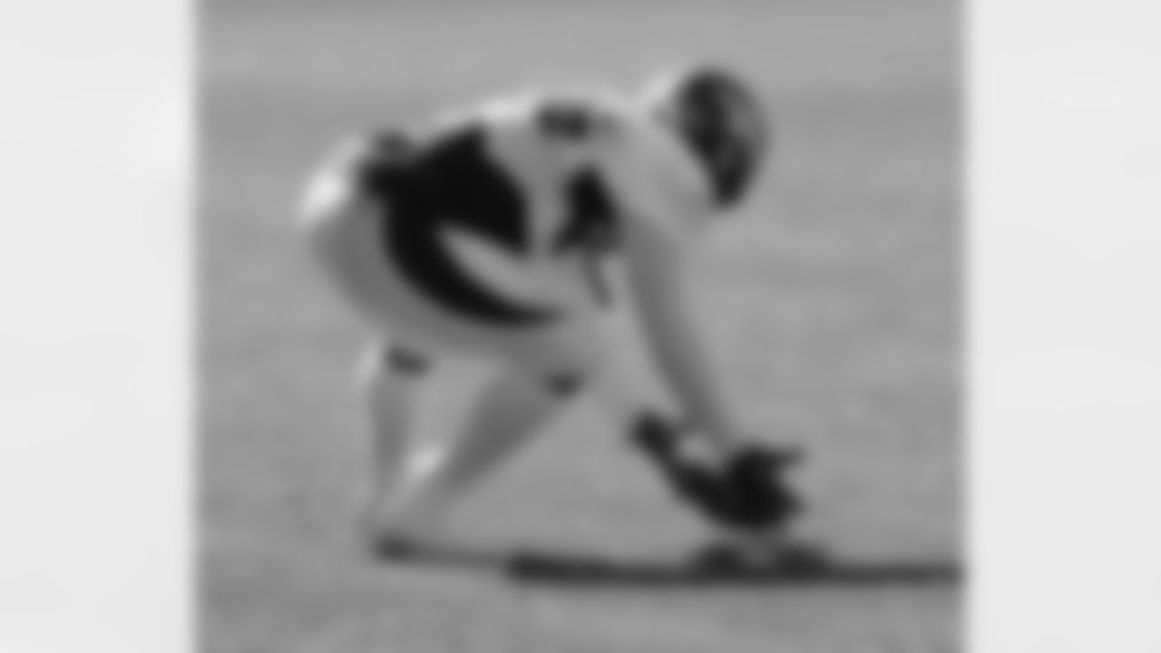 Williams scoops up a loose ball.