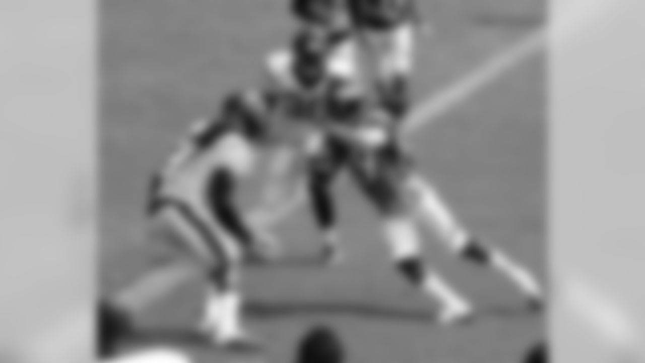 A play after scoring a touchdown, Burse catches another pass and turns toward the goal line.