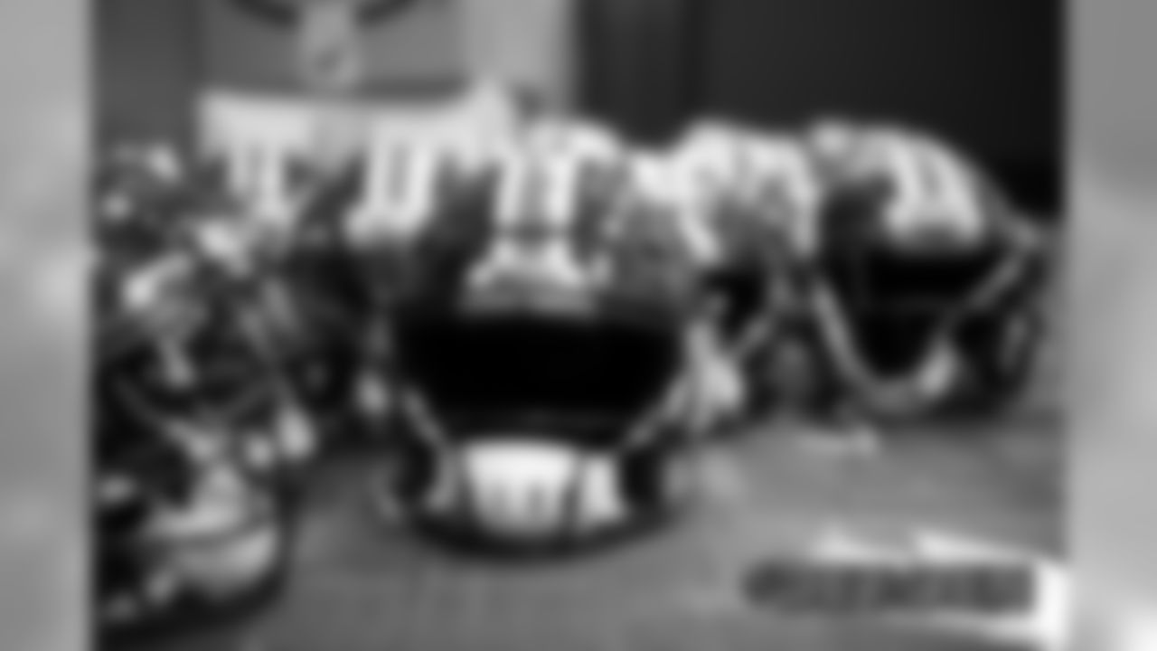 Members of the equipment staff apply new Color Rush stripes and throwback logo decals onto helmets ahead of the team's Week 16 game against the Lions on December 17, 2019 at UCHealth Training Center. (Photo by Ben Swanson)