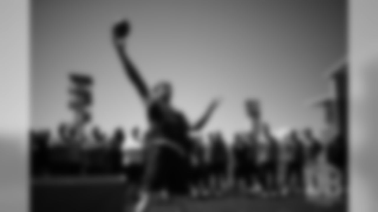 Su'a Cravens competes in the football toss during the Broncos field day on June 6, 2019.