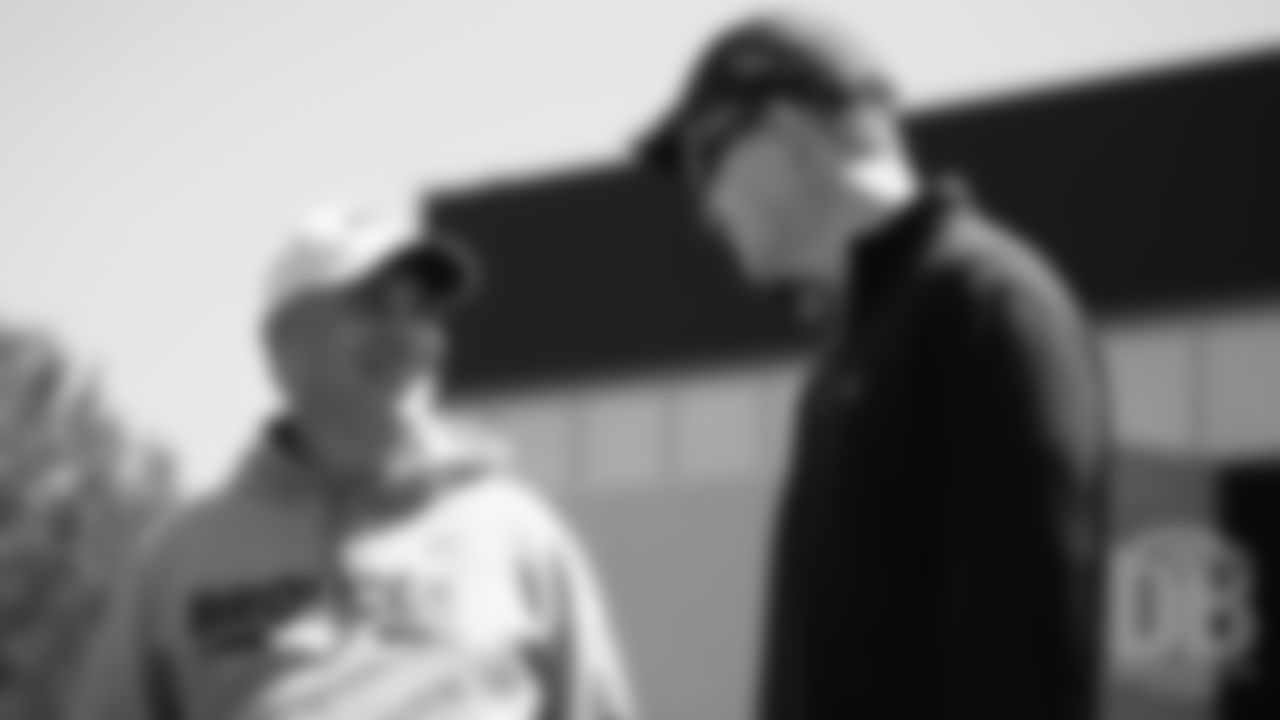 Head Coach Vic Fangio talks with former Broncos quarterback Peyton Manning during the Broncos' practice on the eight day of their OTAs on May 30, 2019.