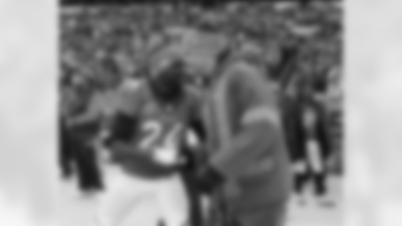 Champ Bailey greets former teammate Jake Plummer before the game against the San Diego Chargers in an AFC divisional playoff NFL game at Sports Authority Field in Denver, CO on January 12, 2014.
Photo by Gabriel Christus