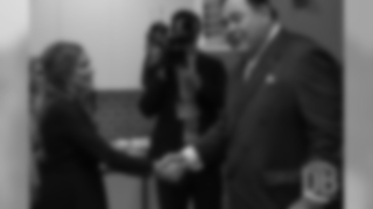 Brittany Bowlen shakes hands with David Baker after he gave the news that Pat Bowlen was elected for enshrinement in the Pro Football Hall of Fame's Class of 2019 on February 2, 2019.