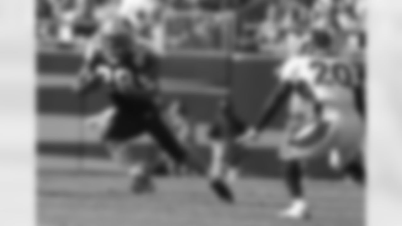 Panthers RB Jonathon Stewart looks to get past S Mike Adams.