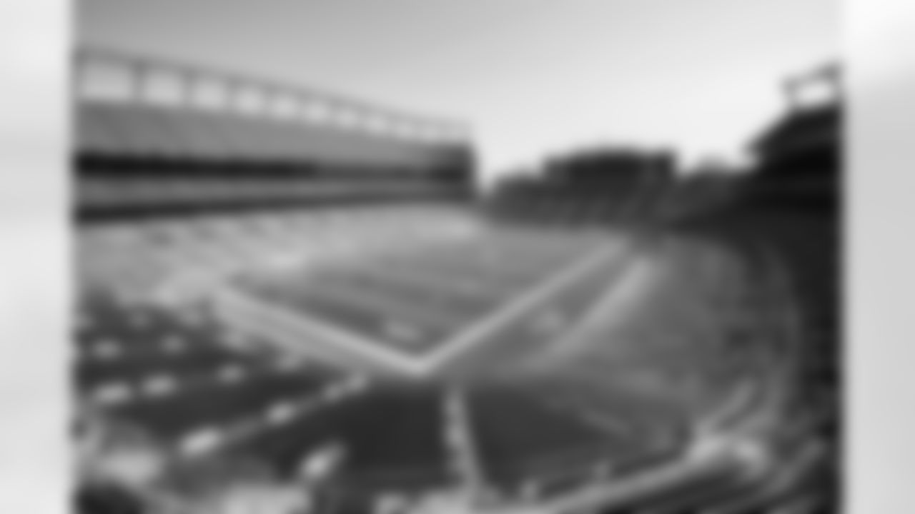Members of the stadium's turf crew paint the field at Empower Field at Mile High on September 23, 2021 ahead of the team's Week 3 home opener. (Photo by Ben Swanson)