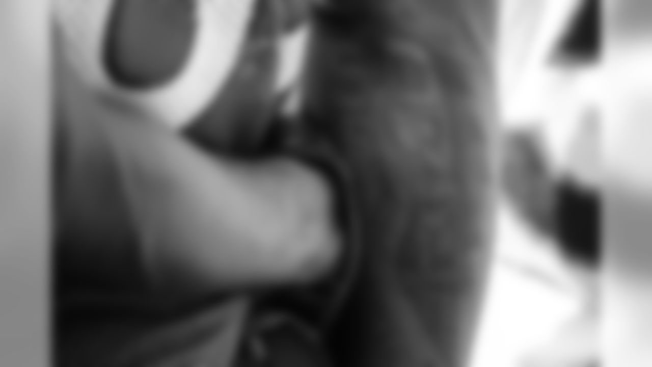 On his right arm, Demaryius Thomas sports tattoos recalling his first day as a Denver Bronco and the Super Bowl 50 trophies he won as part of the team.