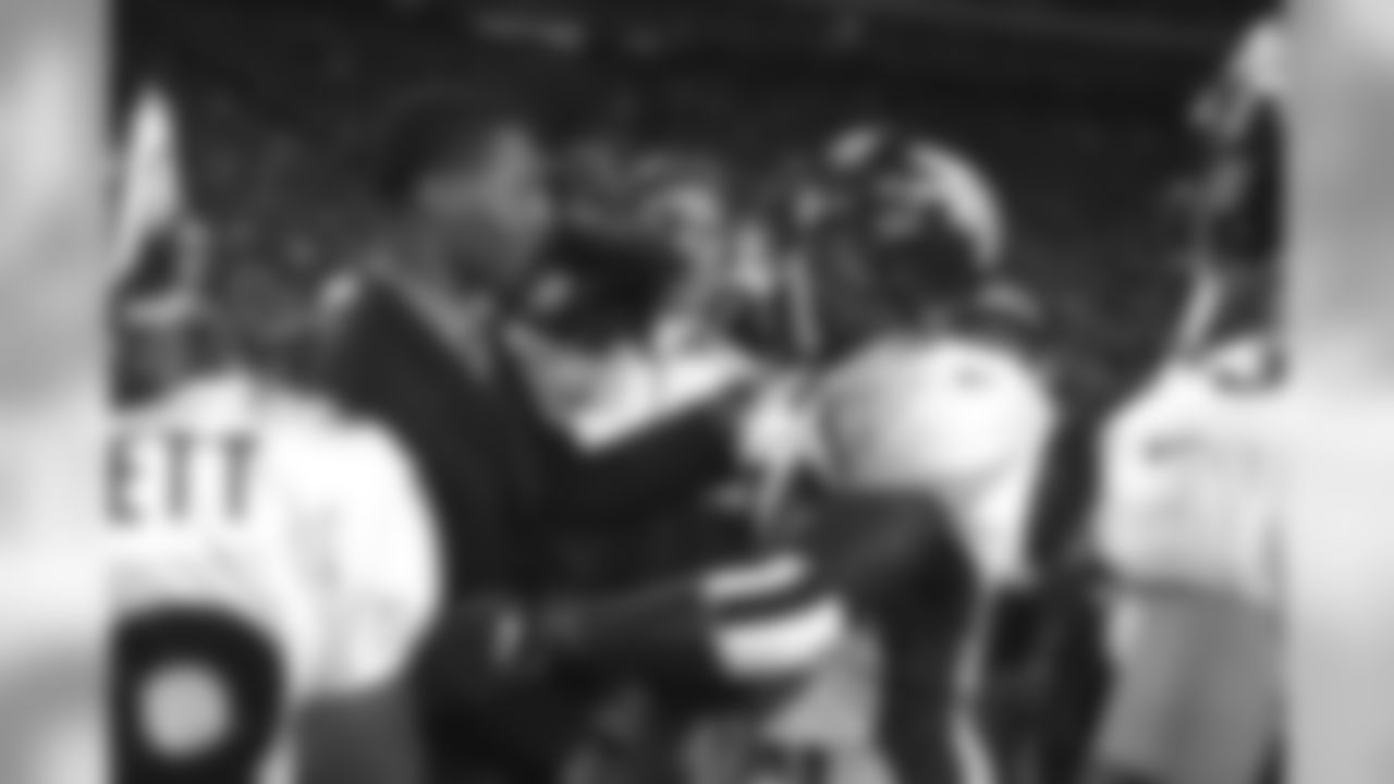 Marcus Allen (left) and Terrell Davis (right) greet one another after the game against the Kansas City Chiefs at Arrowhead Stadium in Kansas City, MO on November 16, 1998. In addition to both being Super Bowl MVPs, the two legendary running backs also went to the same high school.