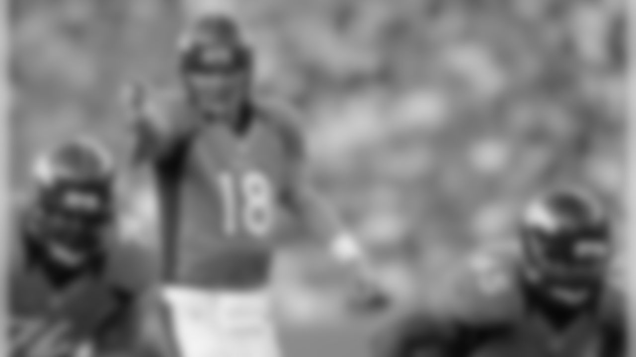 Manning makes a call at the line of scrimmage.