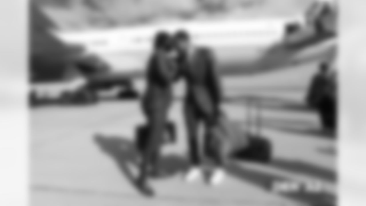 Isaac Yiadom and Courtland Sutton walks on the tarmac to the plane before the flight during the team's travel for their Week 7 game against the Arizona Cardinals on October 17, 2018.