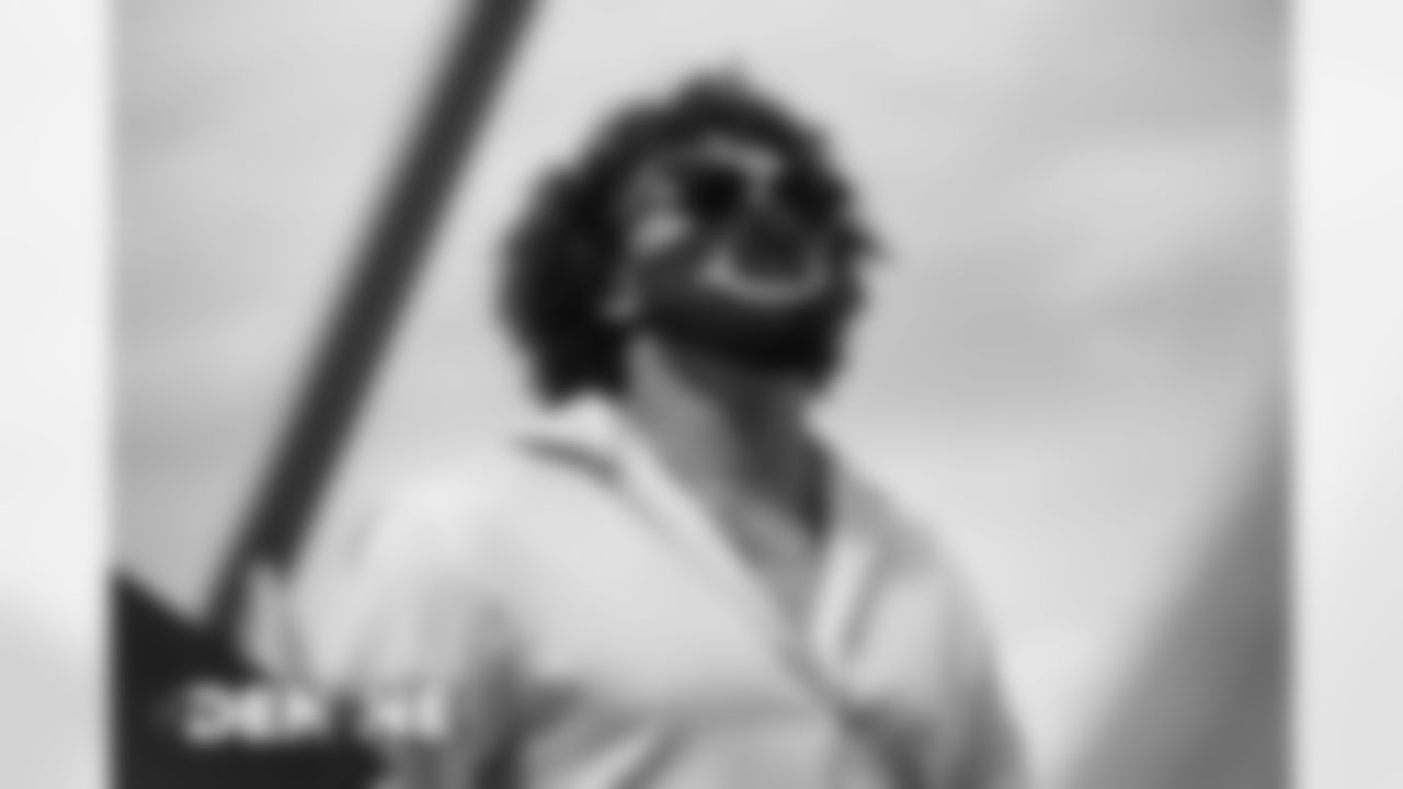 Phillip Lindsay on the tarmac at Denver International Airport on October 17, 2020 during the team's travel to New England for a Week 6 game against the Patriots. (Photo by Ben Swanson)