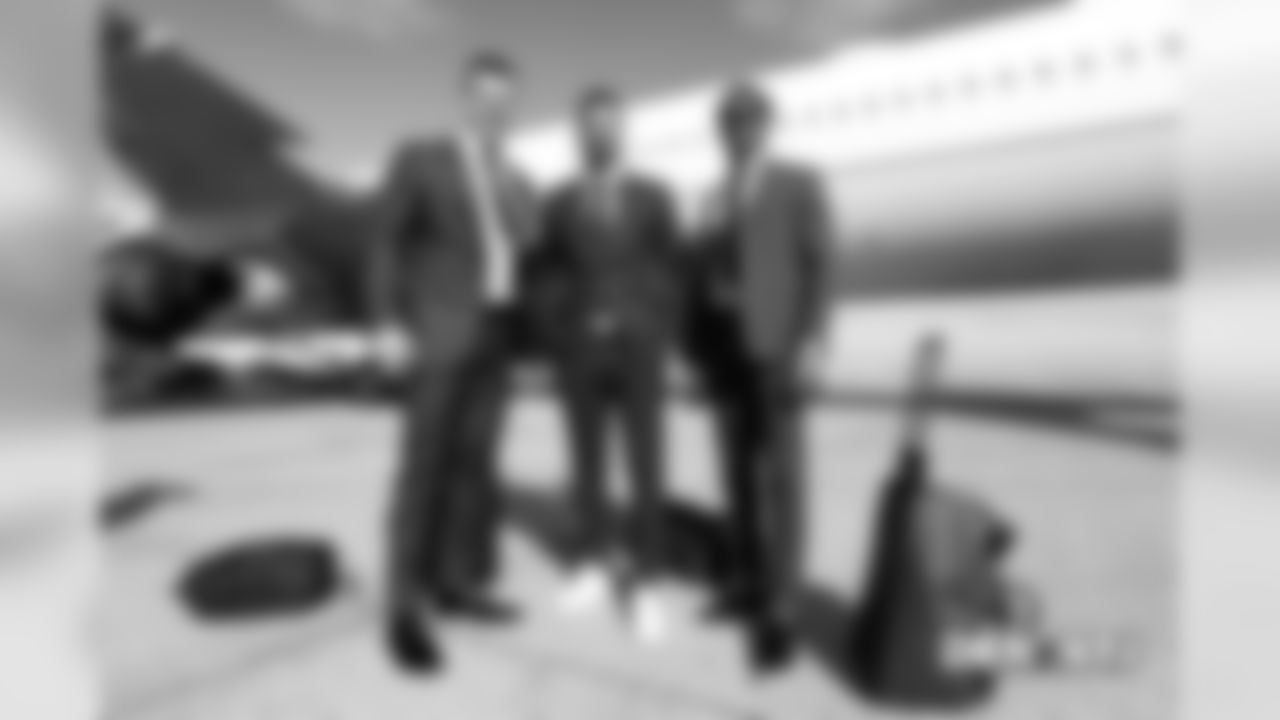 Jeff Heuerman, Brandon McManus and Demaryius Thomas take a group photo on the tarmac at Denver International Airport during the team's travel for their Week 5 game against the New York Jets on October 6, 2018.
