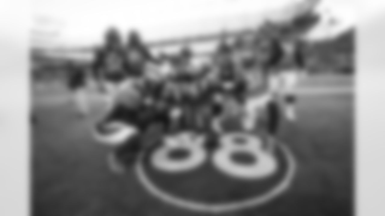 Several members of the defense celebrate a fumble recovery at the No. 88 logo painted on the field in Thomas' honor during the game against the Detroit Lions on Sunday, December 12, 2021.
Photo by Gabriel Christus