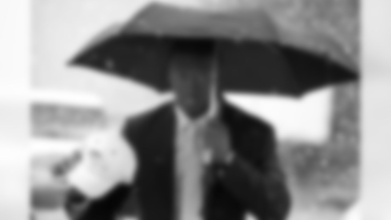 Demaryius Thomas, the Broncos' first pick of the 2010 NFL Draft, arrived in the rain wearing a pinstriped suit in a light-peach shirt and tie.