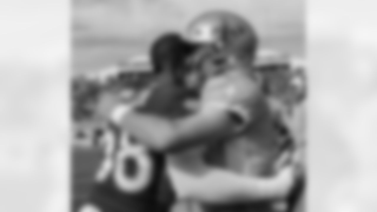 Von Miller greets New Orleans Saints quarterback Drew Brees (9) during pregame warmups before the 2020 Pro Bowl on January 26, 2020 at Camping World Stadium in Orlando, Florida. (Photo by Ben Swanson)