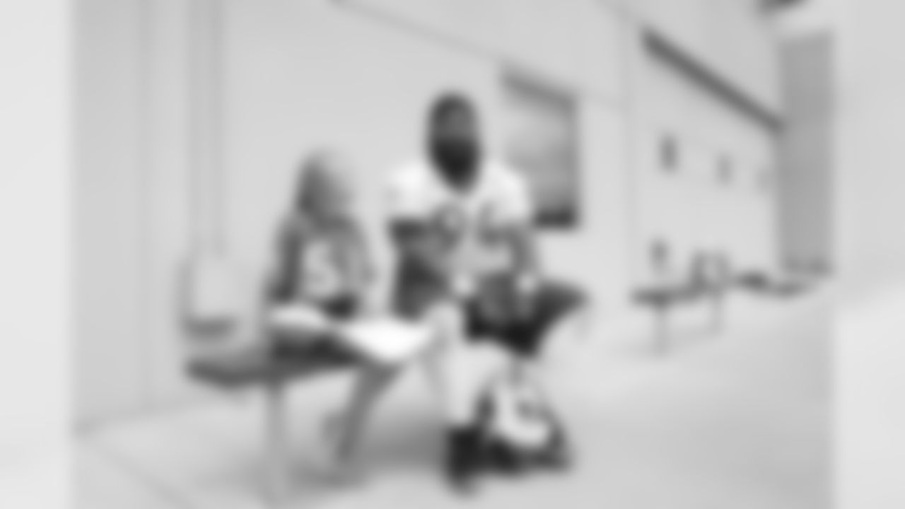 Children's Hospital Colorado junior reporter Kaylea interviews Domata Peko Sr. after practice on September 5, 2018 at UCHealth Training Center.