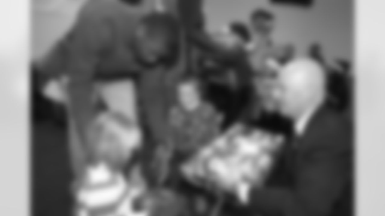 Various players, including Jimmy Spencer, Rod Smith, and Keith Burns, were on hand at the Denver Rescue Mission to help pass out Christmas presents to needy children.