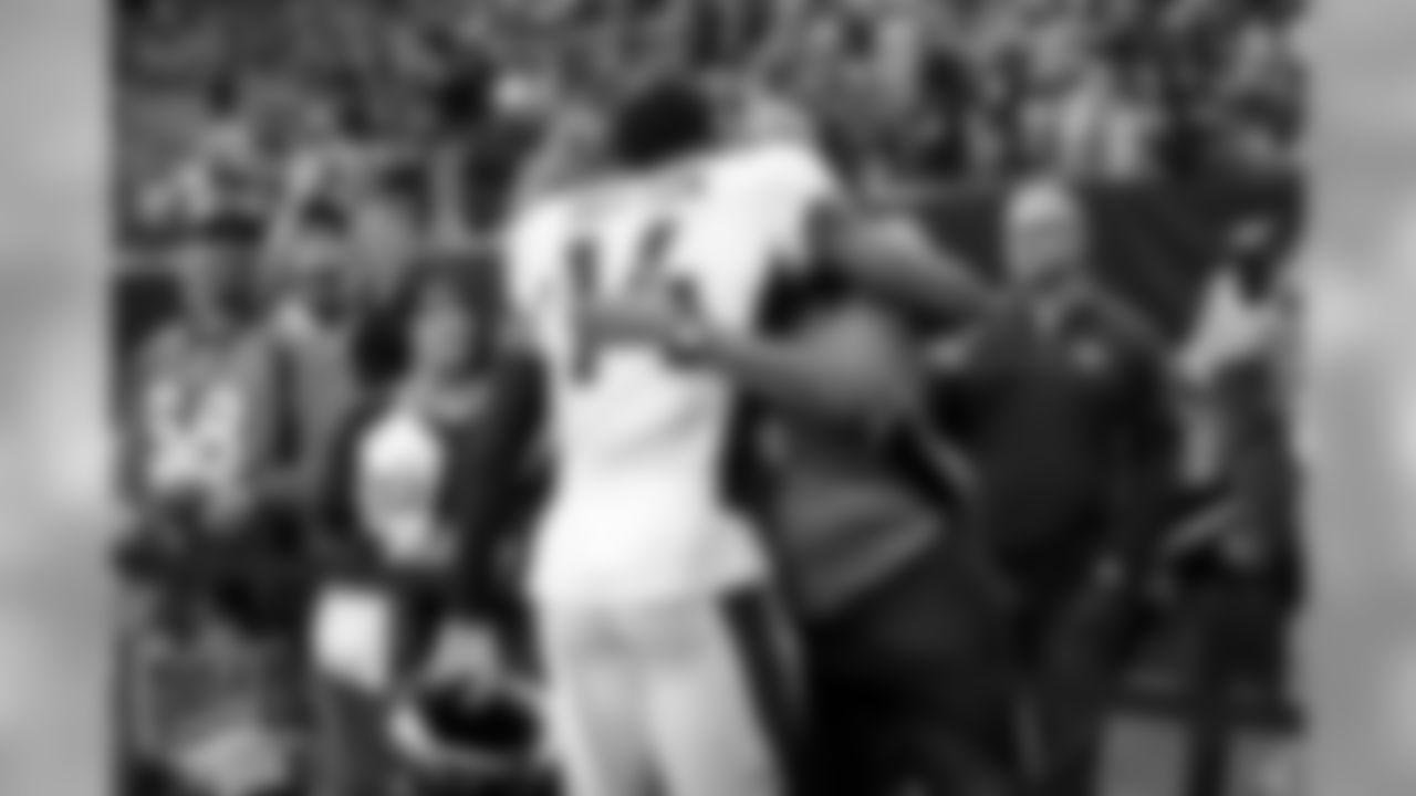 Courtland Sutton hugs his mother before the Broncos' Week 14 game against the Houston Texans at NRG Stadium on December 8, 2019. (Photo by Ben Swanson)