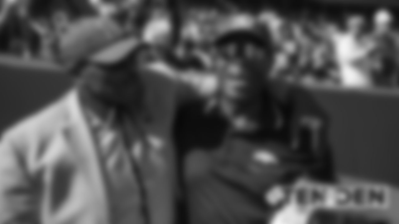 Floyd Little and Billy Thompson before the Broncos' game against the Tennessee Titans at Empower Field at Mile High on October 13, 2019. (Photo by Ben Swanson)