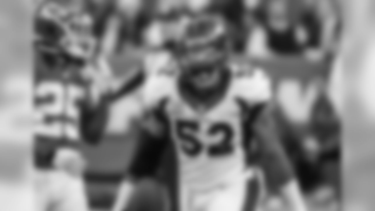 Denver Broncos linebacker Wesley Woodyard (52) celebrates an interception during first quarter action against the Kansas City Chiefs in the NFL game at Arrowhead Stadium in Kansas City, MO on December 1, 2013.