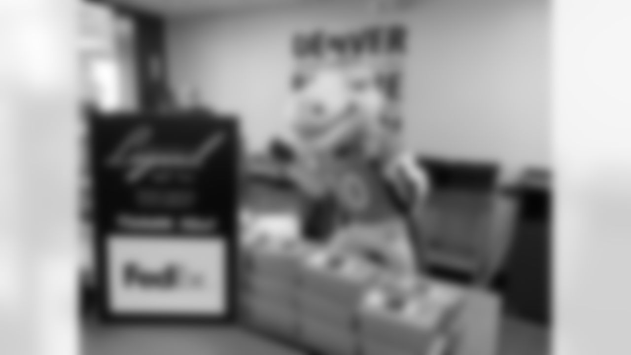 Denver Broncos Cheerleaders and Miles the Mascot delivery more than 1,800 gourmet boxed lunches, prepared by Epicurean Catering, to healthcare professionals, local nonprofits, first responders, teachers, and essential and frontline workers.