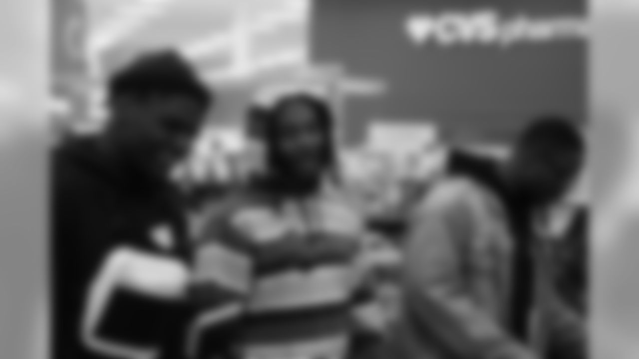 Jeff Holland, Bradley Roby and Will Parks during Will Parks' shopping spree for the Boys & Girls Club of Metro Denver on Dec. 3, 2018