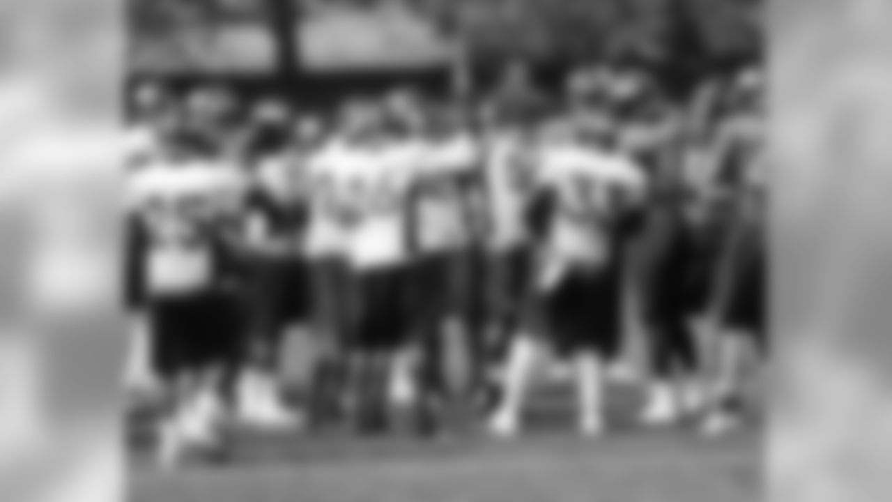 The team huddles before practice.