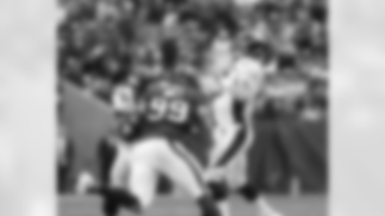Manning throws his NFL-record 51st touchdown pass of the season to cap the scoring in Denver's 37-13 win at Houston.