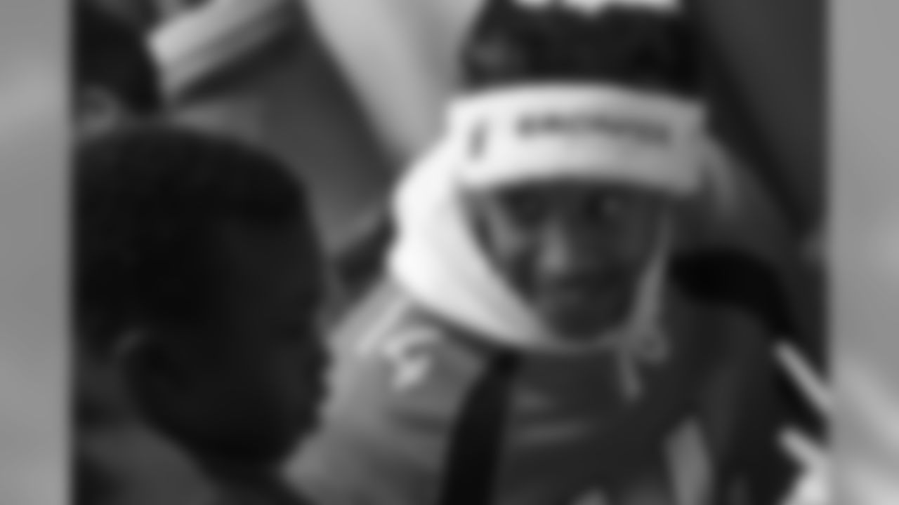 Courtland Sutton helps a boy decorate cookies at the Broncos' Boys & Girls Club holiday party for about 200 children from the Boys & Girls Clubs of Metro Denver at UCHealth Training Center on December 17, 2018.