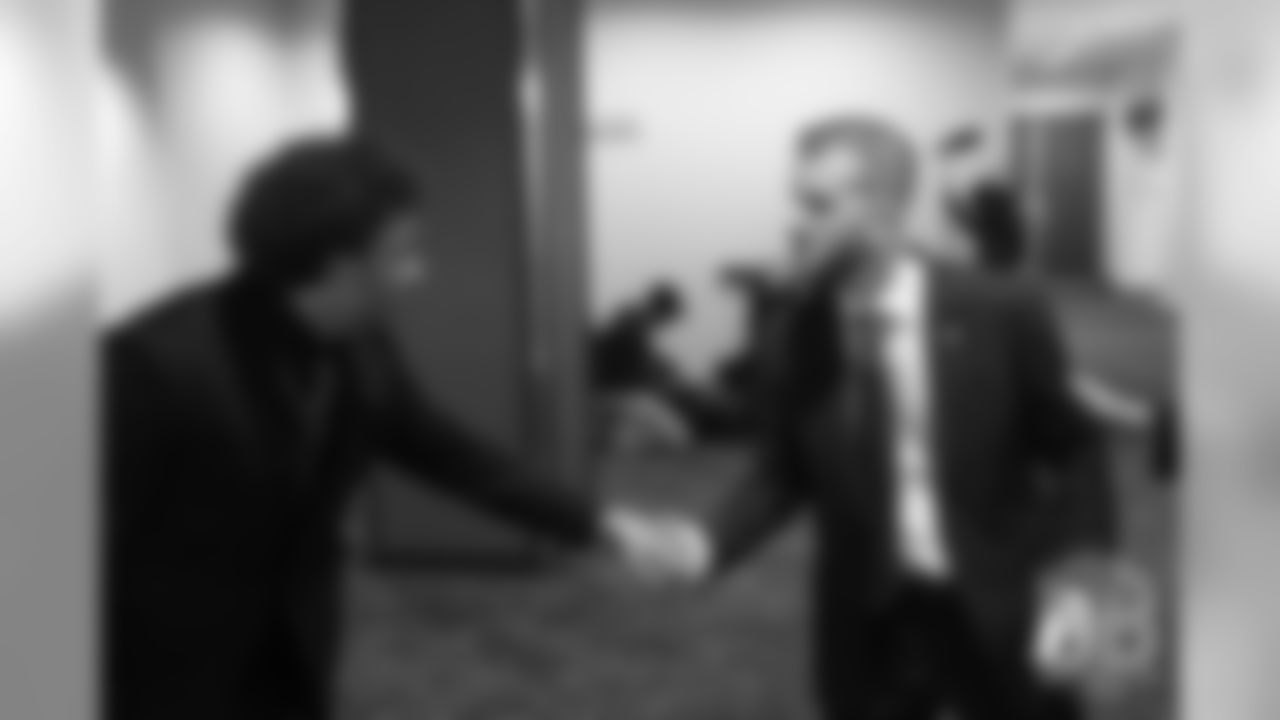 Patrick Bowlen Jr. greets Phillip Lindsay await the knock on the door announcing the Pro Football Hall of Fame's selection of Pat Bowlen for enshrinement in the Class of 2019 on February 2, 2019.