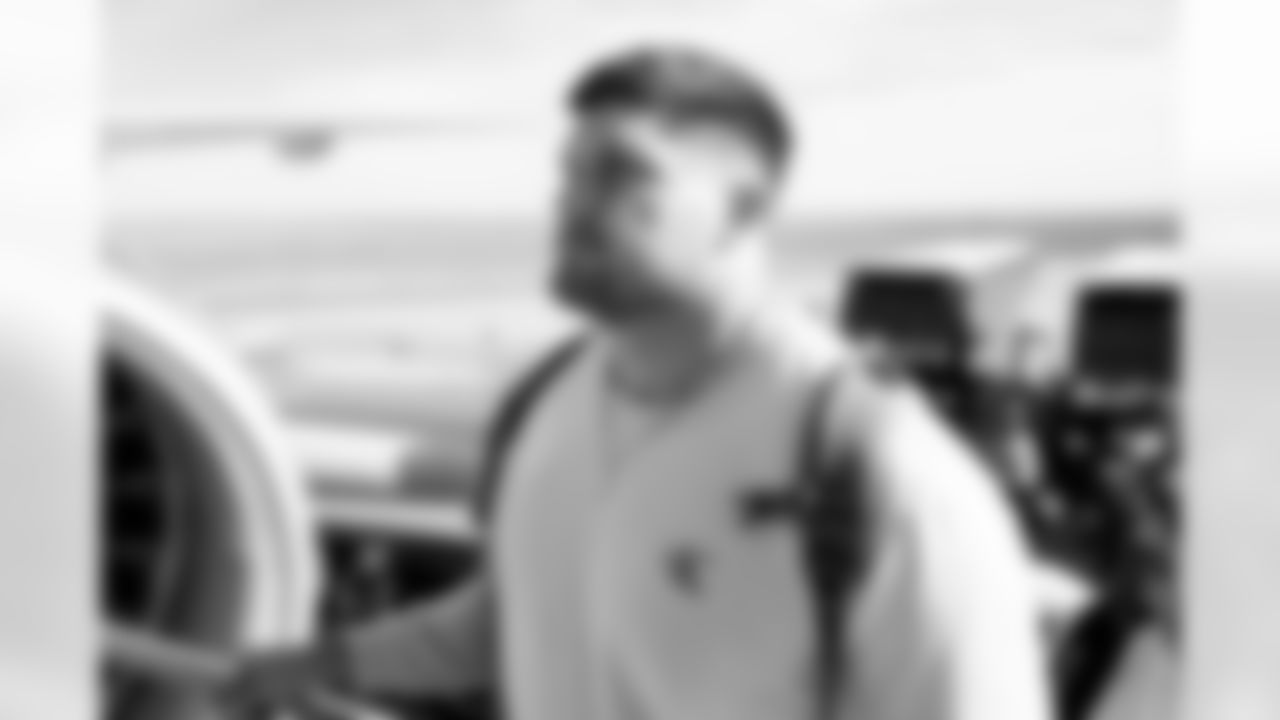 Matt Henningsen on the tarmac at Denver International Airport on October 16, 2022 during the team's travel to Los Angeles for a Week 6 game against the Chargers. (Photo by Ben Swanson)