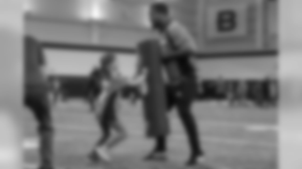 Bradley Chubb takes a defensive position as a young girl looks to run past him during a PLAY 60 All-Ability Clinic with the National Sports Center for the Disabled for 200 athletes at UCHealth Training Center at April 30, 2019.