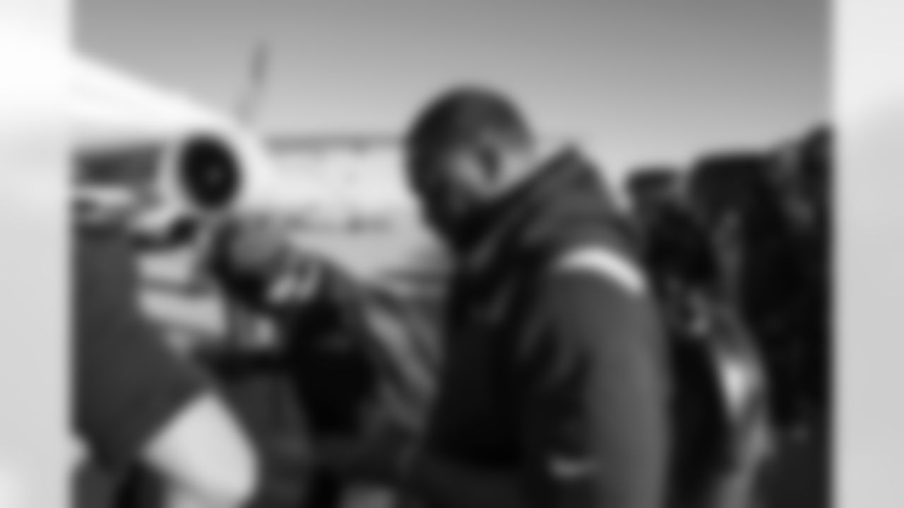 Shelby Harris on the tarmac at Denver International Airport on December 4, 2021 during the team's travel to Kansas City in Week 13. (Photo by Joe Abdellah)