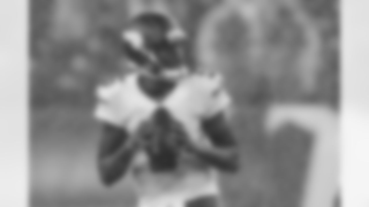Minnesota Vikings quarterback Teddy Bridgewater drops back to pass against the Tennessee Titans in the rain during the first quarter of a preseason NFL football game Thursday, Aug. 28, 2014, in Nashville, Tenn. (AP Photo/Mark Zaleski)