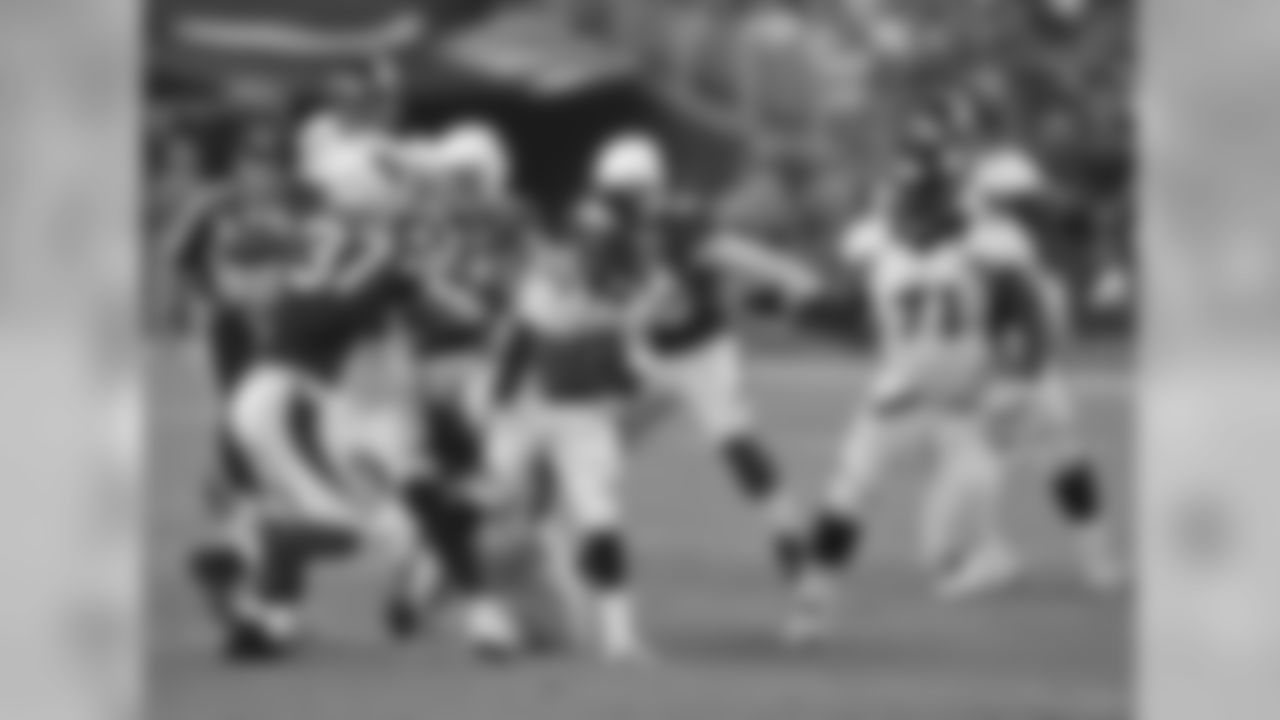 Running back Ronnie Hillman runs through the Arizona defense.
