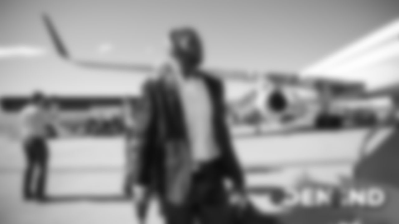 Theo Riddick on the tarmac at Denver International Airport during the team's travel to Indiana on October 26, 2019 ahead of their Week 8 game against the Indianapolis Colts. (Photo by Ben Swanson)