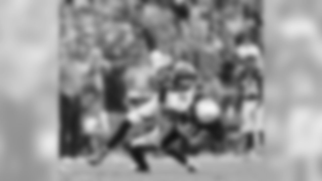Addae flips Sanders to the turf after his big grab.