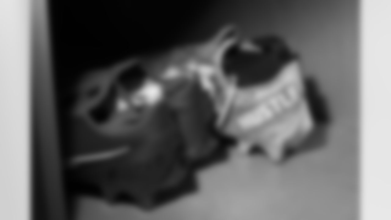Javonte Williams's cleats in the locker room before the Broncos' Week 18 game against the Kansas City Chiefs at Empower Field at Mile High in Denver, Colorado on January 8, 2022. (Photo by Ben Swanson)