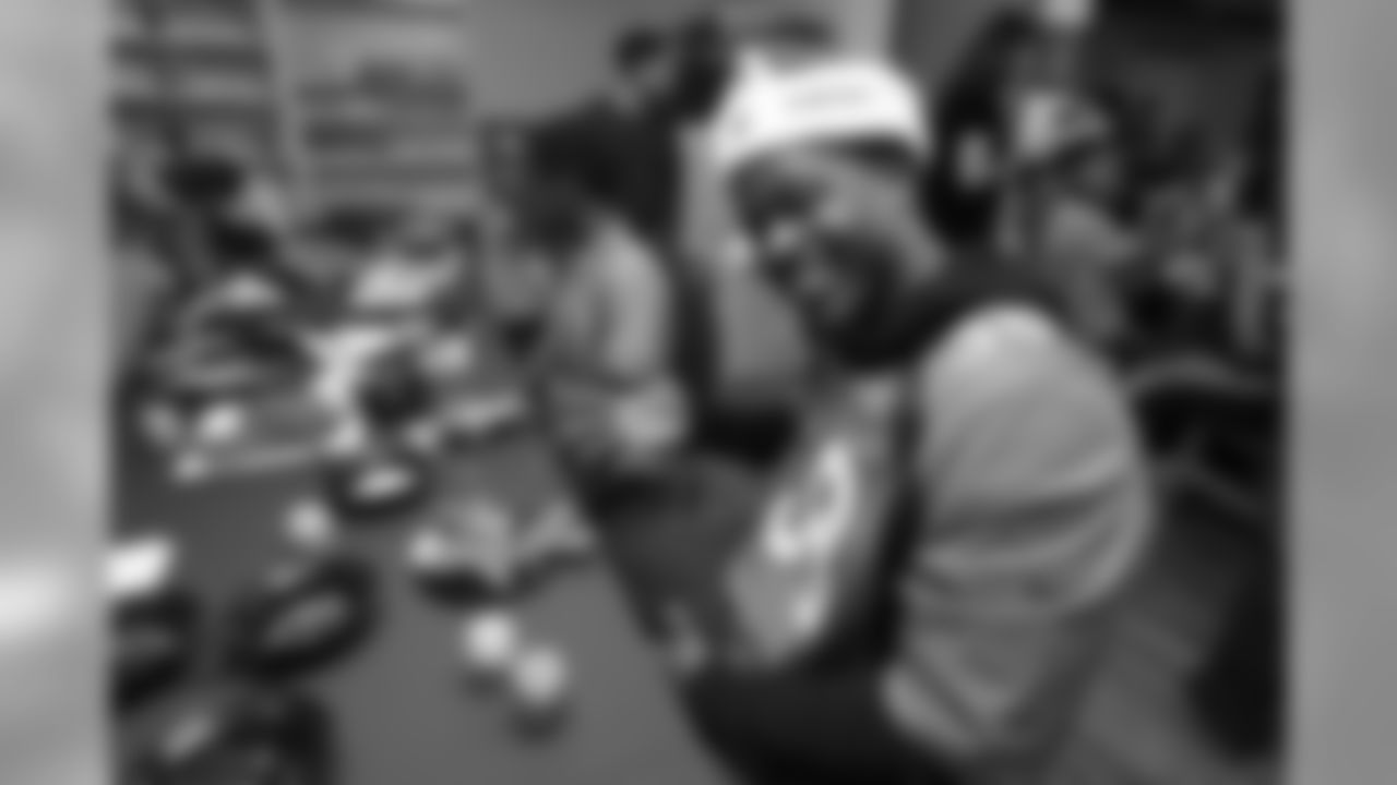 Shamarko Thomas decorates gingerbread cookies at the Denver Rescue Mission's 19th annual holiday party.