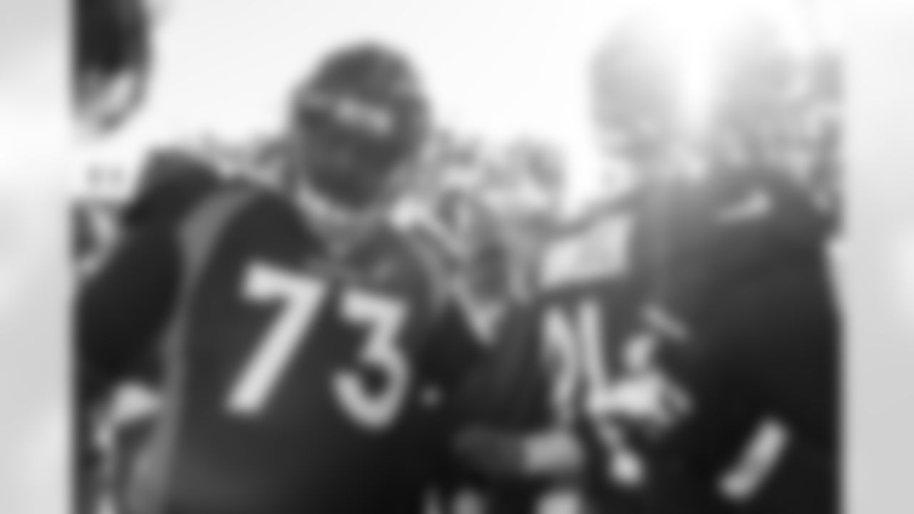 Russell Wilson speaks to the team in the huddle during pregame warmups before the Broncos' Week 14 game against the Kansas City Chiefs at Empower Field at Mile High in Denver, Colorado on December 11, 2022. (Photo by Ben Swanson)