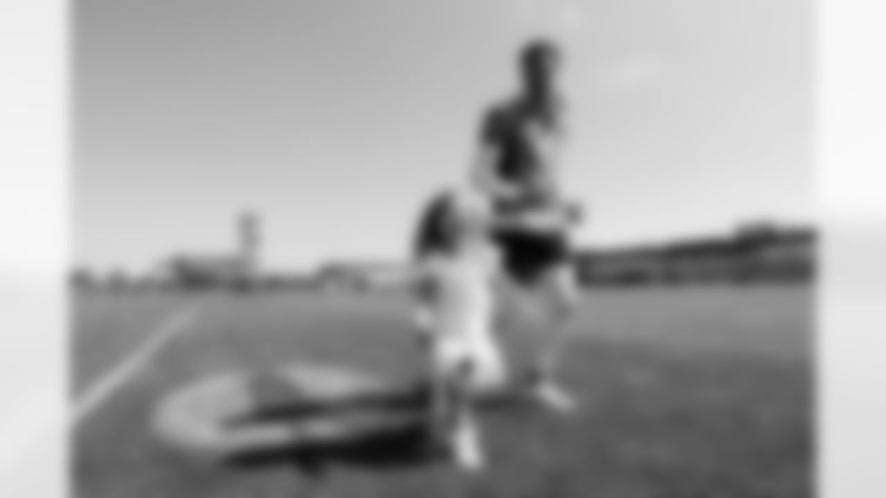 Justin Simmons and his daughter Laney after practice on Day 17 of training camp at UCHealth Training Center on August 19, 2021. (Photo by Ben Swanson)